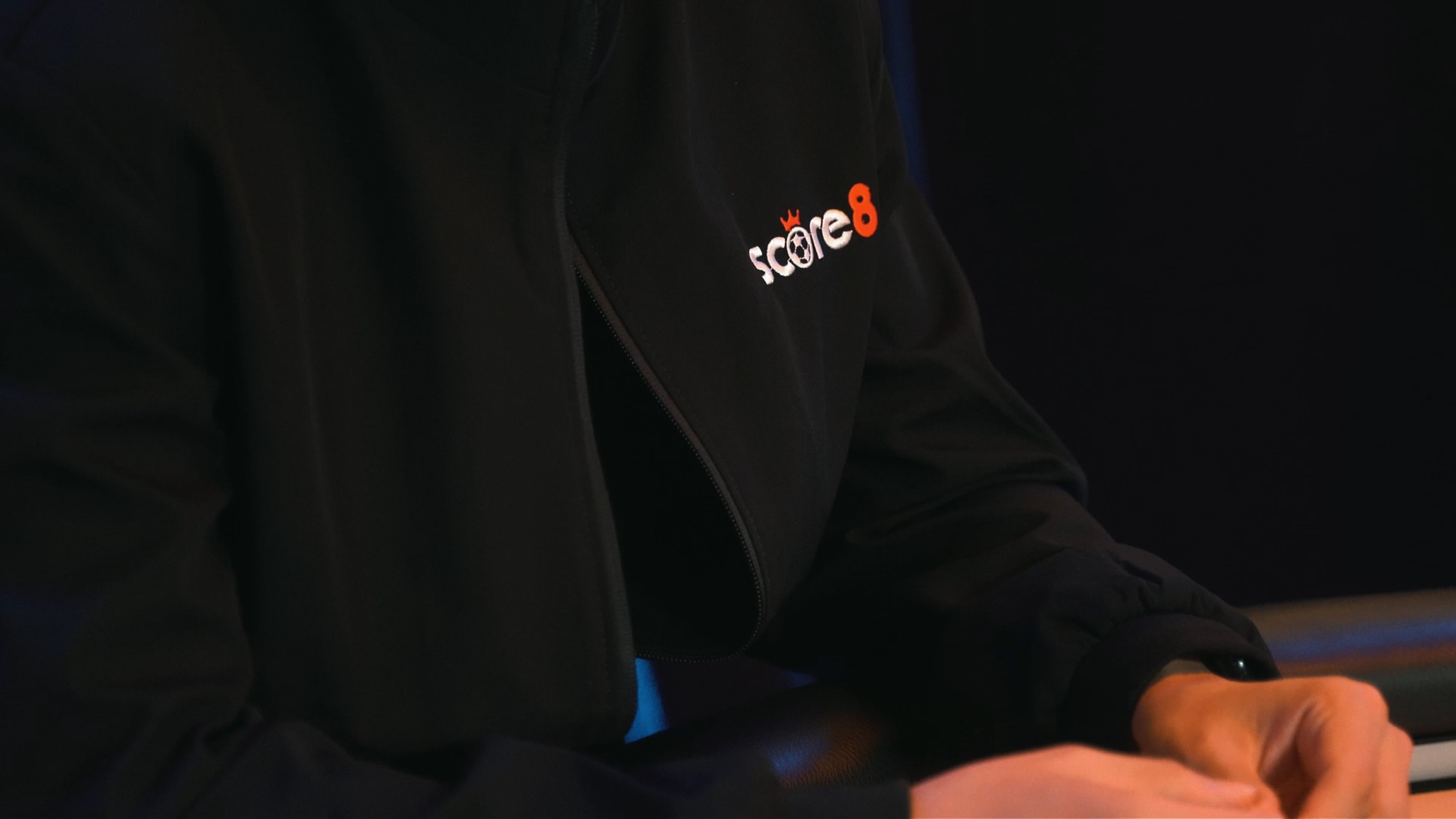 Score8 branding worn at a live event